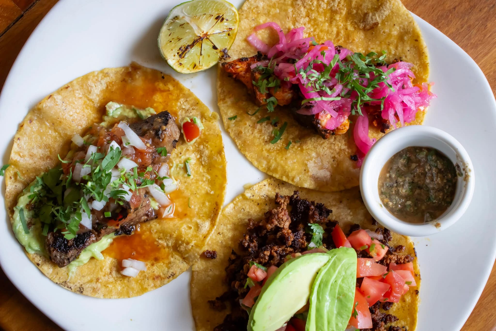 Taco plate garnished with fresh radishes at Las Gardenias